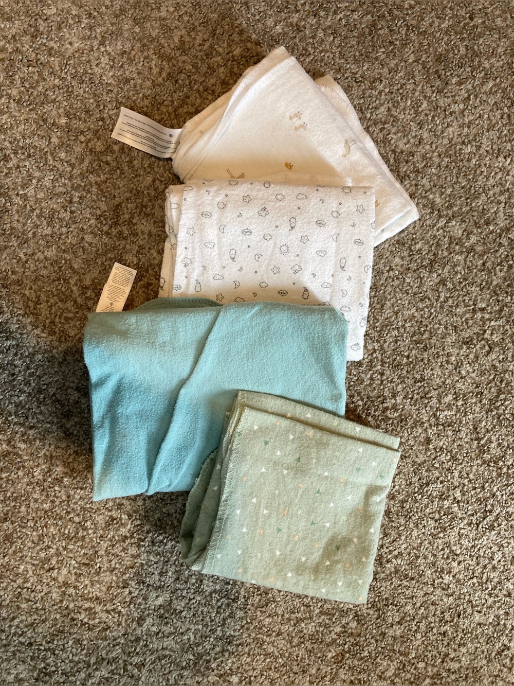 Four cotton receiving blankets